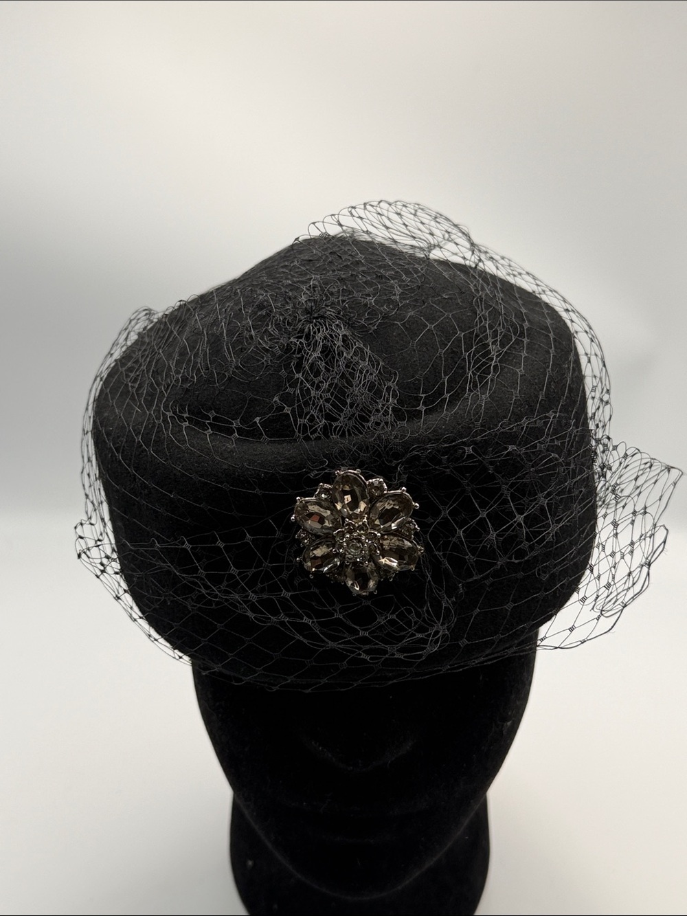 Black Veiled Pillbox Hat with Decorative Brooch